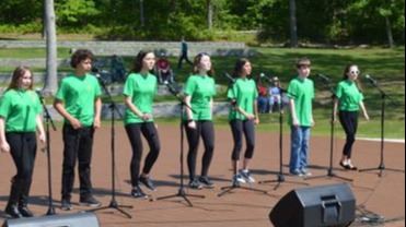 Singers at Good Ground Park opening day